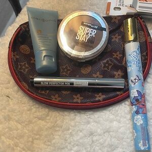 Clarisonic Gel Cleanser and other items with makeup bag
